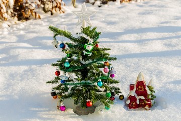 Close up view of decorative Christmas tree with small toys. Christmas Holiday Concept. Postcard. Beautiful backgrounds.