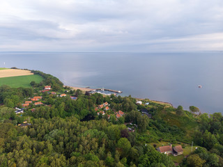 Aerial view of Norreborg harbor on the island of Ven in southern Sweden during a summer sunrise