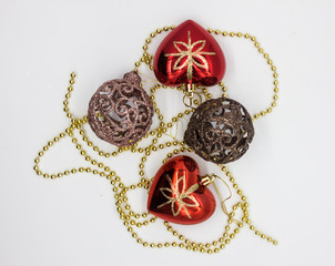 Christmas toys balls and gold decoration on a white background