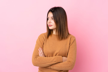 Fototapeta premium Young woman over isolated pink background portrait
