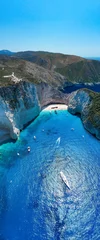 Wall murals Navagio Beach,  Zakynthos, Greece Portrait aerial drone shot of Zakynthos Navagio beach with yachts and cruise ship in Ionian sea in Greece