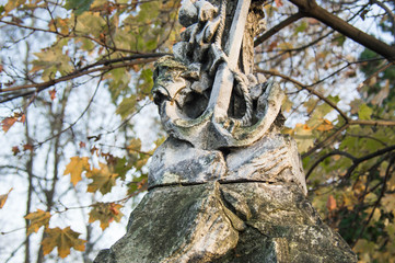 Radom, Poland - 1november 2019 year: Monument and candles in the cemetery. All Saints Day in Poland. Stone anchor. The grave of a sailor.