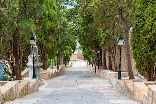 Staircase steps with trees alley to the calvary of pilgrimage church in Arta, Mallorca, Spain