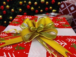 gift box with red ribbon and bow