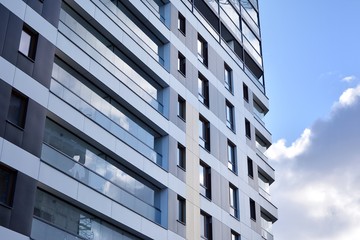 Fragment of modern residential apartment with flat buildings exterior. Detail of new luxury house and home complex. 