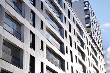 Fragment of modern residential apartment with flat buildings exterior. Detail of new luxury house and home complex. 