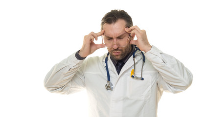 Male doctor hloding hands on his head. Headache and stress
