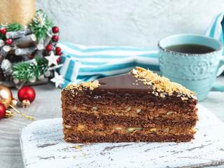 sponge cake with nuts and chocolate, caramel layers