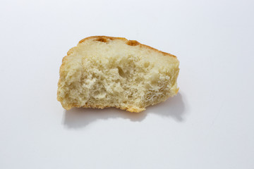 bitten piece of old white bread