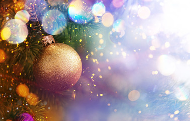 Fototapeta na wymiar Christmas and New Year holidays background. Glitter lights backdrop. Winter season. Text space. Closeup of Christmas-tree.