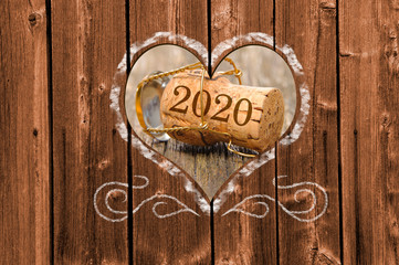Happy new year 2020 with cork stopper of bottle champagne