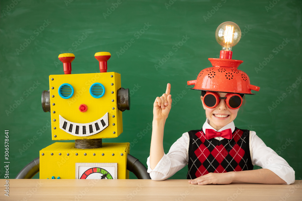 Canvas Prints happy child with toy robot in school