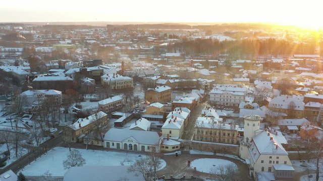 Aerial view of beautiful ruins of ancient Livonia castle in old town of Cesis, Latvia, winter morning sunrise time