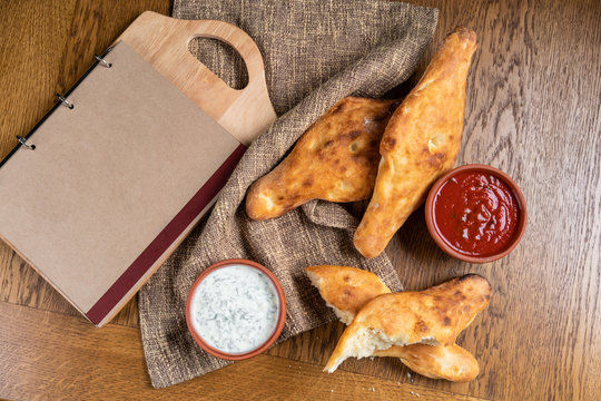 Georgian pita bread on a wooden grate