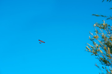 Blue sky and airplanes. Small plane in the sky.