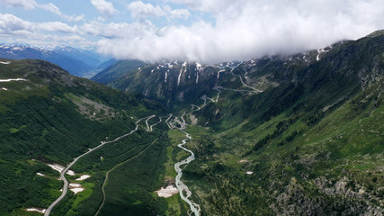 Aerial view of mountain winding road Furka pass in Alps, Switzerland. © dimabucci