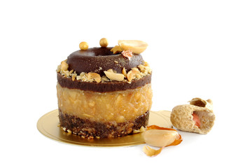 Chocolate peanut mini cake with caramel and peanut butter isolated on white background