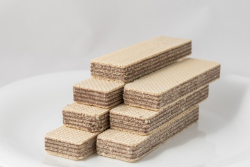 Wafers on the white plate on a white background