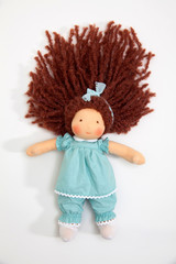Handmade baby doll on white background