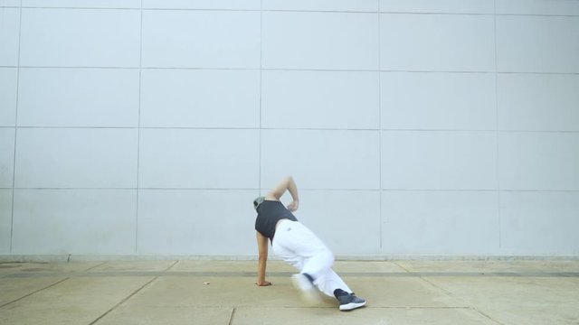 Overweight man wearing sportswear while doing hip hop dance at outdoor. Shot in 4k resolution
