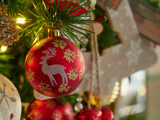 christmas tree and decorations. red bauble ball on Christmas tree branches. Close up