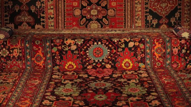 Large oriental rug with colorful patterns. Handmade rug production, carpet close-up with all the details