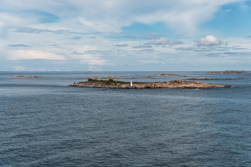 Fototapeta na wymiar Small stone islands in the sea on a clear sunny day