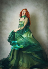Fototapeta na wymiar Woman in green fantasy dress