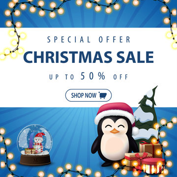 Special offer, Christmas sale, up to 50% off, square blue discount banner with garland, snow globe, penguin in Santa Claus hat with presents and Christmas tree