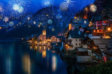 Hallstatt in Austria celebrating New Years Eve with flashing colorful fireworks