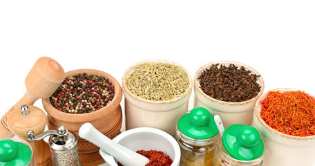 Aromatic spices on white background . Wide photo.