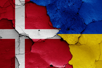flags of Denmark and Ukraine painted on cracked wall