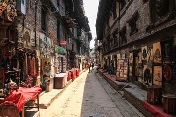 BHAKTAPUR, NEPAL - APRIL 22, 2014:The main attraction of Nepal is the city of Bhaktapur, destroyed by an earthquake. wooden carvings, painting and art of Nepal. UNESCO World Heritage.