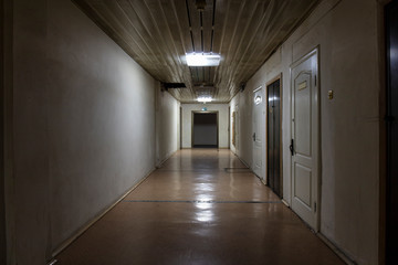 Long dark corridor in an old industrial building