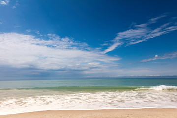 Fototapeta na wymiar Beach, water, blue sky and clouds, Sanibal Island, Florida, USA