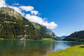 Fototapeta na wymiar Natural mountain lake Klöntalersee . Glarus Canton. Switzerland.