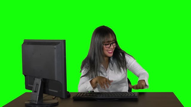 Excited Young Businesswoman Hitting Table As A Drum While Sitting In The Studio. Shot In 4k Resolution With Green Screen Background