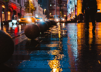 Wet night city street rain Bokeh reflection bright colorful lights puddles sidewalk Car