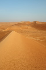 Fototapeta na wymiar Mountains of shifting sand dunes in the Arabian desert near Riyadh, Saudi Arabia
