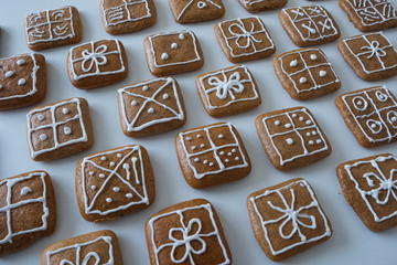 Christmas gingerbread decorated with lemon glaze, christmas cookies.  Decorated gingerbread Christmas gifts on white background. Czech Republic
