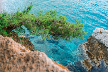 Beautiful view from the cliff to the clear azure sea.