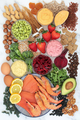 Health food for vitality, energy & fitness with fish, fruit, vegetables, pasta, nuts, dips, dairy, cereal & herbal medicine. High in vitamins,  antioxidants, smart carbs, protein & omega 3. Flat lay.