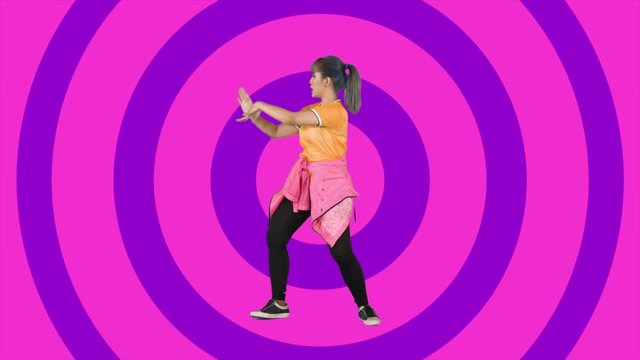 Loop animation footage of a happy young woman dancing while standing with circles moves background