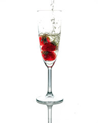 High glass with champagne and strawberries