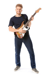 Handsome man with guitar on white background
