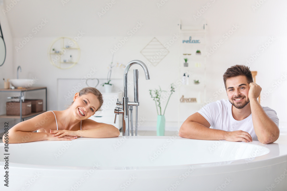 Sticker happy young couple going to take bath together