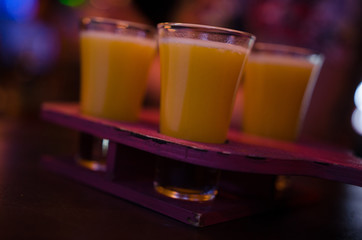 A set of yellow shots in one row