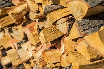 Chipped firewood is on the heap. Firewood for furnace heating. Warehouse for firewood for stove