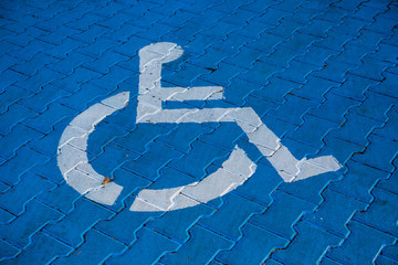 Parking site for disabled person painted in blue