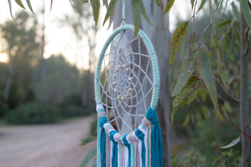 dreamcatcher on ground and leafs. relax and handmade. Handcraft and ecological